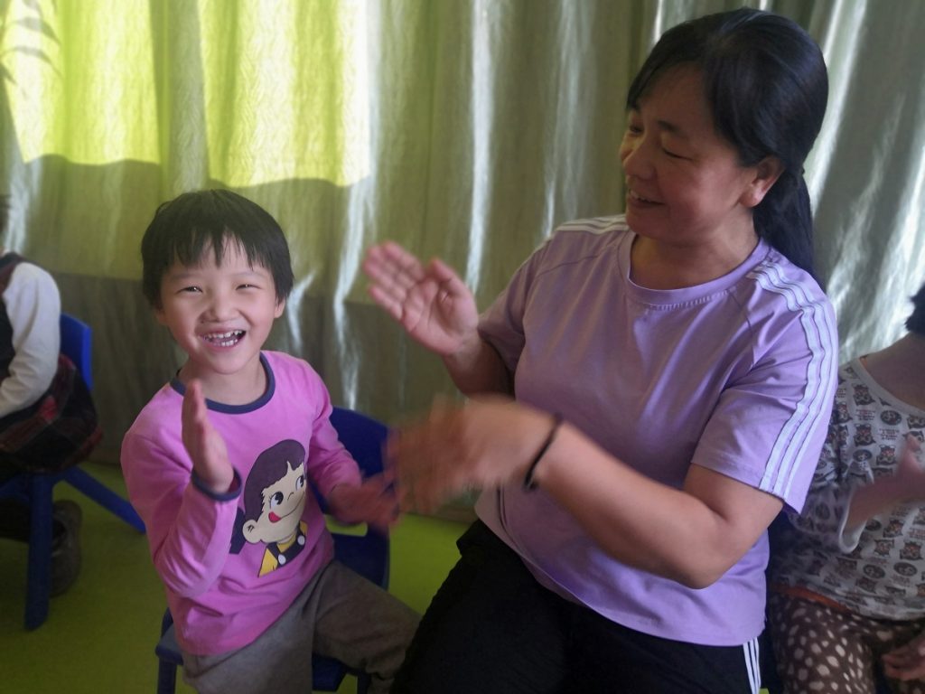 Ling Playing With Her Caregiver