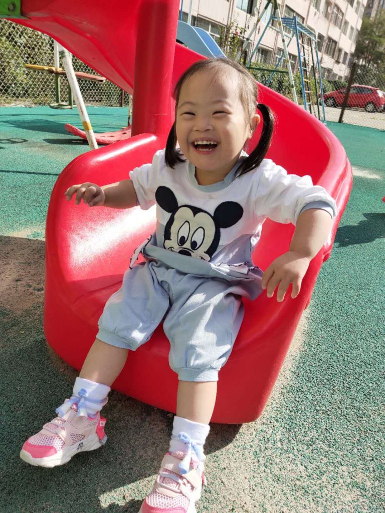 Yue Coming Down The Slide